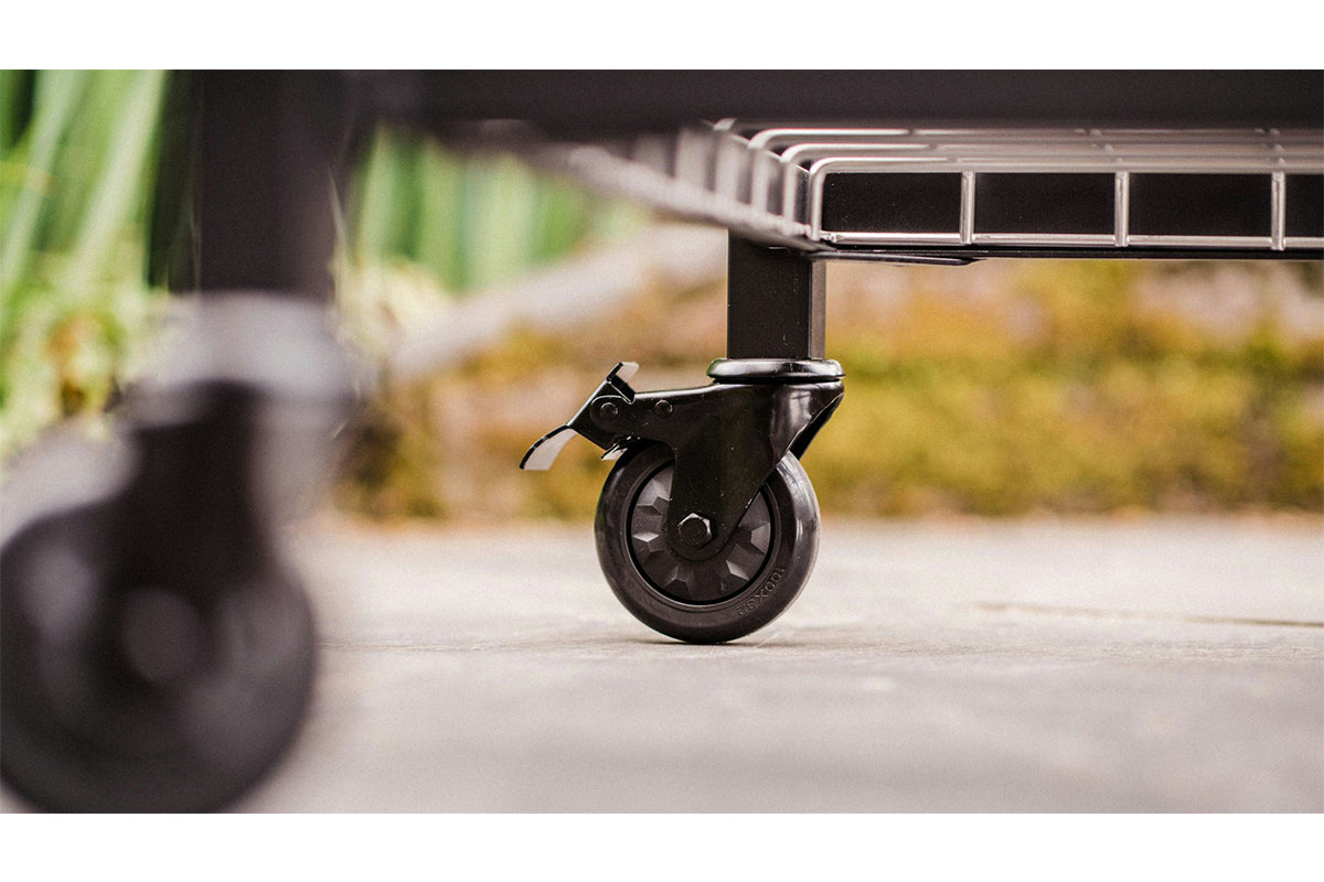 Close-up of the caster wheels on the Big Green Egg modular nest for enhanced mobility and convenience.