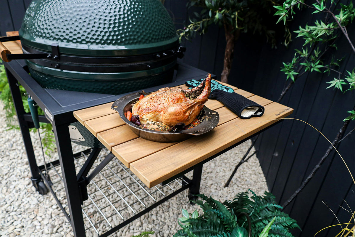 Big Green Egg modular nest with roasted chicken, showcasing its versatility in outdoor cooking.